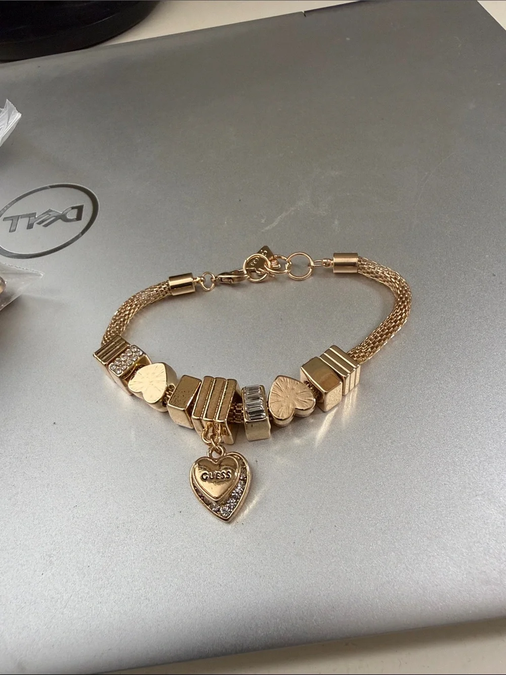 Gold color Guess mesh. Charm bracelet 8”.   NWOT.  Beautiful